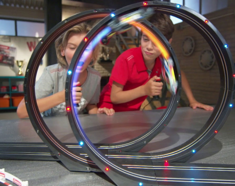 kids playing with racing circuit