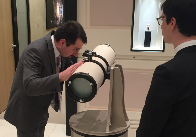 Man looking into the telescope of Jaeger-Le-Coultre event experience