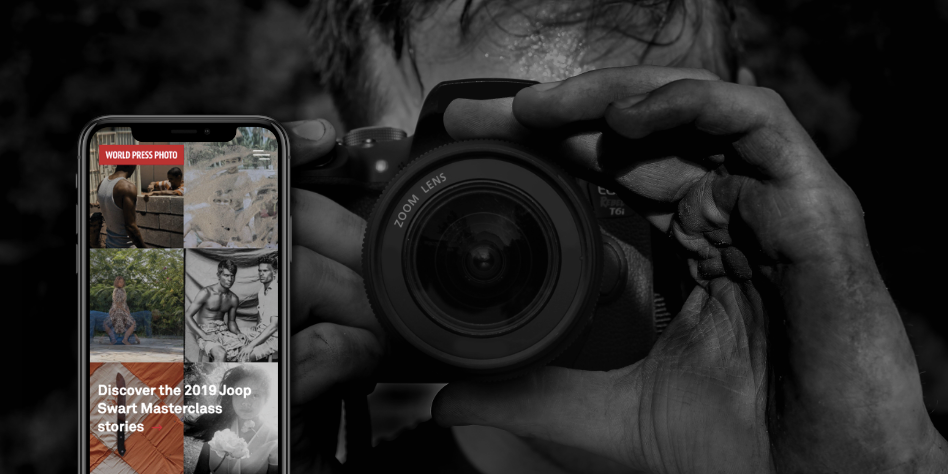 Picture of photographer with a camera and the WPPF website on a smartphone