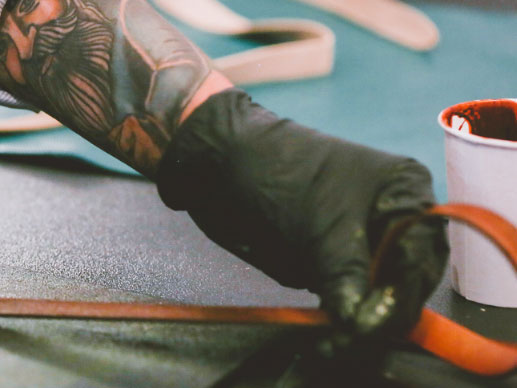 Image of a craftman working leather