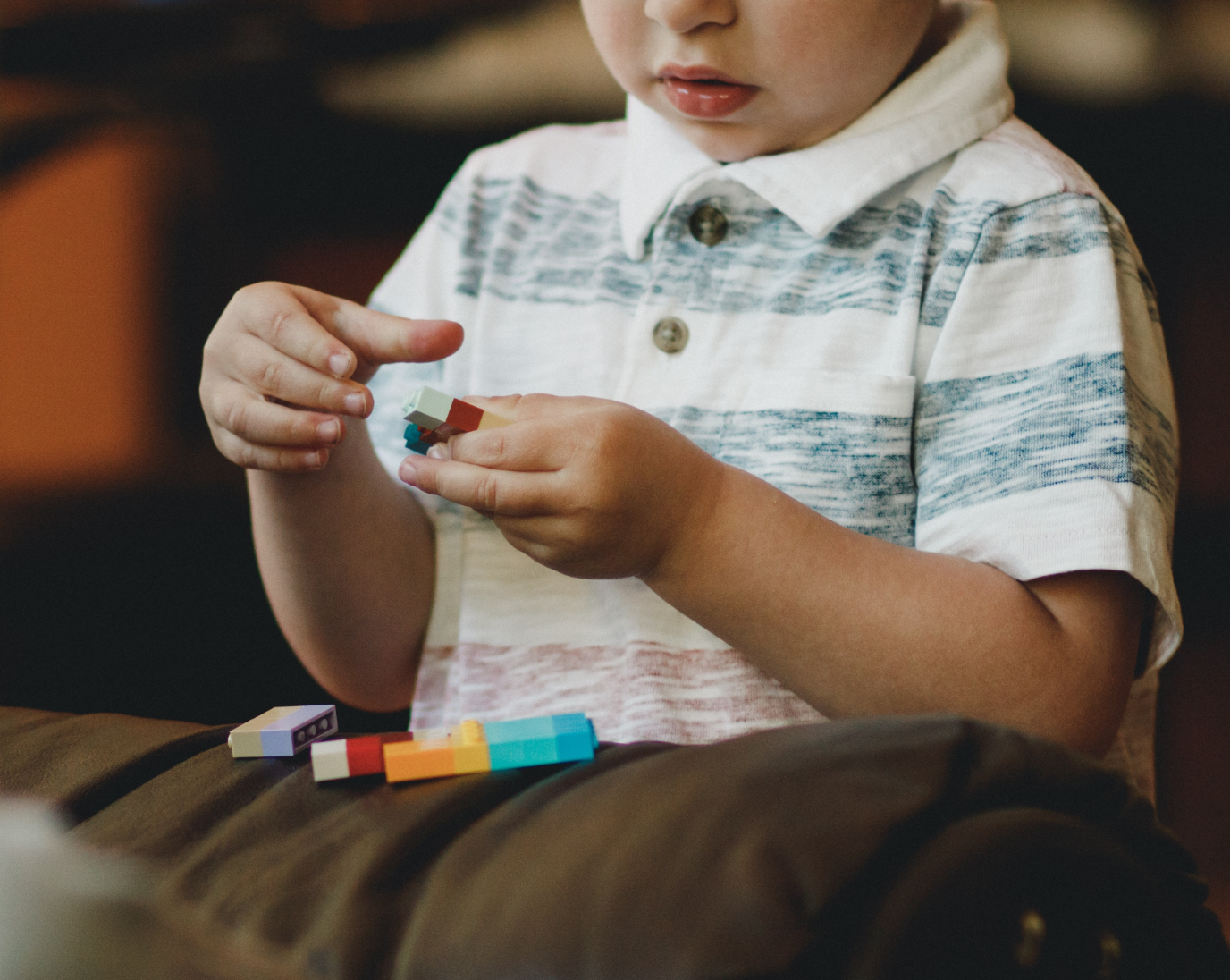 Child playing with LEGO bricks